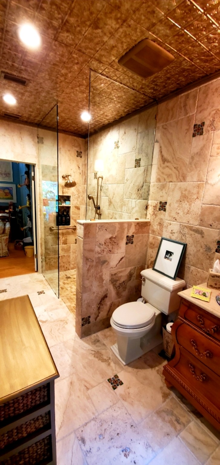 Guest bathroom glass shower after renovation