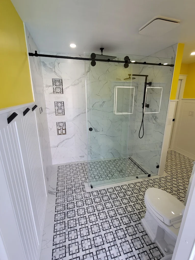 Completed luxury bathroom with glass walk-in shower
